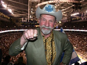 Eddie Shack shows off one of his Stanley Cup rings in this file photo.