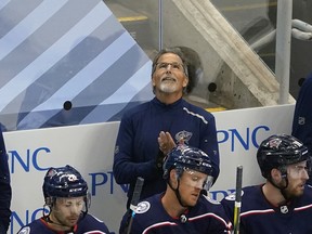 Head coach John Tortorella of the Columbus Blue Jackets tends to bench duties during the final minutes of his 4-1 victory over the Boston Bruins on Thursday.
