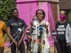 Lawyer Saron Gebresellassi is pictured speaking during a Black Lives Matter protest on July 19, 2020 in front of a defaced statue of Egerton Ryerson at the Ryerson University Campus.