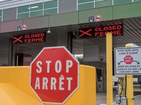 Two closed Canadian border checkpoints are seen after it was announced that the border would close to "non-essential traffic" to combat the spread of novel coronavirus disease at the U.S.-Canada border crossing at the Thousand Islands Bridge in Lansdowne, Ont., March 19, 2020.