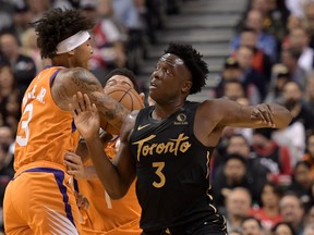 Toronto Raptors forward OG Anunoby knocks the ball loose from Phoenix Suns forward Kelly Oubre Jr. during a game earlier this season.