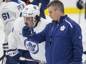 Sheldon Keefe and Auston Matthews talk at Toronto Maple Leaf practice at the Ford Performance Centre in Toronto on Monday November 25, 2019.