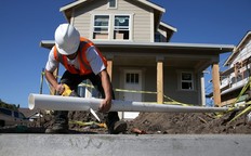 A worker builds a new home.