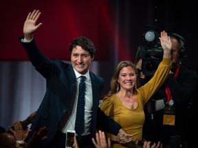 (FILES) In this file photo taken on October 21, 2019 Prime minister Justin Trudeau and his wife Sophie Grégoire Trudeau arrive to celebrates his victory with his supporters at the Palais des Congres in Montreal during Team Justin Trudeau 2019 election night event in Montreal, Canada. - Canadian Prime Minister Justin Trudeaus wife said March 28, 2020 that she has recovered from being ill from COVID-19 disease caused by the new coronavirus. "I am feeling so much better," Sophie Gregoire Trudeau said in a statement on social media. She said she received the clearance from her doctor and Ottawa Public Health. (Photo by Sebastien ST-JEAN / AFP) (Photo by SEBASTIEN ST-JEAN/AFP via Getty Images)