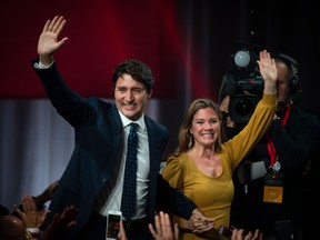 (FILES) In this file photo taken on October 21, 2019, Prime minister Justin Trudeau and his wife Sophie Grégoire Trudeau arrive to celebrate his election victory with supporters at the Palais des Congres in Montreal during a Team Justin Trudeau 2019 election night event in Montreal, Canada. (Photo by SEBASTIEN ST-JEAN/AFP via Getty Images)