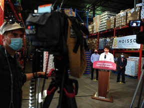 Canadian Prime Minister Justin Trudeau speaks to the press as he volunteers at the Moisson Outaouais food bank in Gatineau, Quebec, Canada, on July 3, 2020.