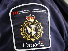 A Canada Border Services Agency patch is seen on an officer in Calgary, Alta., Thursday, Aug. 1, 2019
