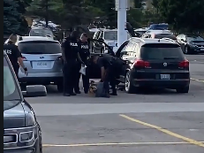 York Regional Police make an arrest in the Vaughan Mills parking lot on Tuesday, July 21, 2020.