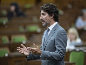 Prime Minister Justin Trudeau rises in the House of Commons Wednesday July 8, 2020 in Ottawa. A Quebec man who was charged last December in connection with alleged online threats against Trudeau and the Muslim community is now being charged with advocating genocide.