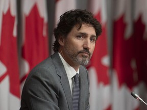 Prime Minister Justin Trudeau listens to a question during a news conference, Wednesday, July 8, 2020 in Ottawa.