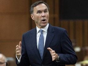 Finance Minister Bill Morneau rises during Question Period in the House of Commons in Ottawa, Monday, July 20, 2020.