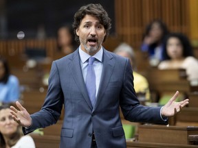 Prime Minister Justin Trudeau rises during a sitting of the Special Committee on the COVID-19 Pandemic in the House of Commons Wednesday July 22, 2020 in Ottawa.