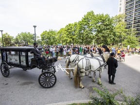 A horse drawn carriage carrying an empty white coffin was part of a public memorial and walk for justice held to honour Regis Korchinski-Paquet, a Black woman who fell to her death from a balcony while police were in her apartment in Toronto on Saturday July 25, 2020.