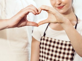 banner hand of couple making gesture heart with love together, man and woman standing in the kitchen at home, just married people, self quarantine lifestyle during coronavirus outbreak crisis