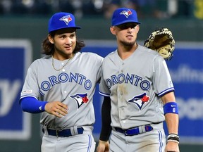 Blue Jays’ middle infield duo of shortstop Bo Bichette (left) and second baseman Cavan Biggio have played for a combined 11 minor-league teams the past three years.