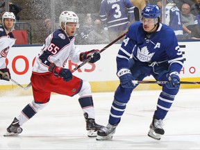 TORONTO, ON - OCTOBER 21:  Markus Nutivaara #65 of the Columbus Blue Jackets skates against Auston Matthews #34 of the Toronto Maple Leafs during an NHL game at Scotiabank Arena on October 21, 2019 in Toronto, Ontario, Canada. The Blue Jackets defeated the Maple Leafs 4-3 in overtime. (Photo by Claus Andersen/Getty Images)