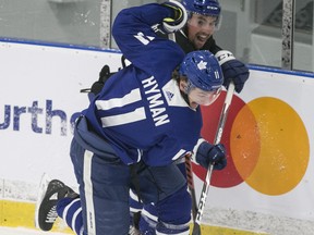 Zach Hyman (front) battes Cody Ceci on the opening day of Maple Leafs camp. While he didn't practice on Sunday, Hyman was on one sheet of ice with Joseph Woll and Kasimir Kaskisuo firing shots at the netminders.