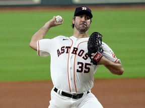Astros starter Justin Verlander pitches in the first inning against the Mariners during Opening Day at Minute Maid Park in Houston, Friday, July 24, 2020.