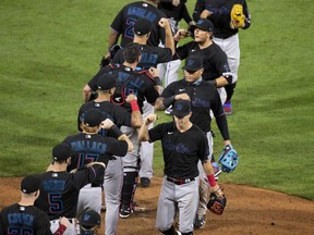 The Miami Marlins celebrate their Opening Day win against the Philadelphia Phillies at Citizens Bank Park on July 24, 2020 in Philadelphia, Pennsylvania