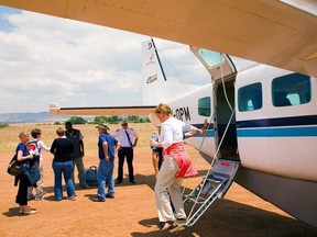 Me to WE Experience guests disembark from an airplane at Minga Lodge in Ecuador.