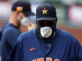 Manager Dusty Baker of the Houston Astros wears a mask during an exhibition game against the Kansas City Royals at Kauffman Stadium on July 21, 2020 in Kansas City.