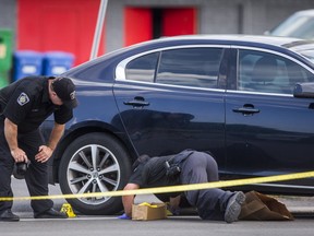 Halton Regional Police on the scene after mob boss Pat Musitano was killed and another injured in a shooting on Plains Rd. E. in Burlington, Ont. on Friday July 10, 2020.