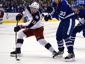 Columbus Blue Jackets forward Pierre-Luc Dubois shoots the puck against the Toronto Maple Leafs during the second period of a game at Scotiabank Arena.