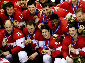 Team Canada players celebrate winning the gold medal after the men's ice hockey gold medal game against Team Sweden at the Bolshoy Ice Dome on the last day of the Sochi 2014 Winter Olympics in Sochi, Russia, on Sunday Feb. 23, 2014. Canada won the game 3-0.