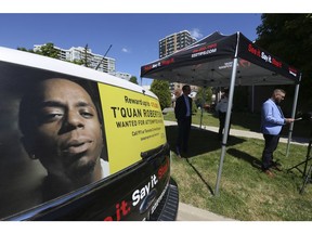 Sean Sportun, (right) Chair of Toronto Crime Stoppers, speaks to the media about a two-year-old shooting and search for T'Quan Robertson.