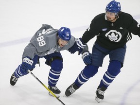 At one point on Saturday during training camp, Maple Leafs' hopeful Nick Robertson (left) forced defenceman Justin Holl into a turnover inside the blue line, allowing Austing Matthews to scoop up the puck and skate in to beat Frederik Andersen.