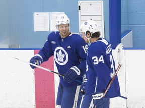 Maple Leafs veteran Jason Spezza (left) and Auston Matthews have a laugh at training camp on Saturday.