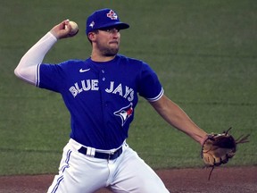 Toronto Blue Jays third baseman Travis Shaw  throws to first base during an intrasquad game at Rogers Centre.