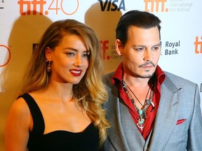 Johnny Depp with his wife Amber Heard on the red carpet for the movie “Black Mass” during the Toronto International Film Festival in Toronto, Sept. 11, 2015.