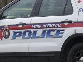 A 57-year-old Markham man has been charged after he allegedly yelled racial slurs and damaged a vehicle in Unionville.