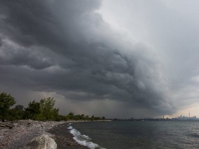 Storm clouds are seen from Humber Bay Park West as they approach the skyline in Toronto, Sept. 5, 2017.