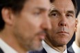 Canada's Minister of Finance Bill Morneau looks at Prime Minister Justin Trudeau during a press conference in Ottawa, Ontario, Canada March 11, 2020.