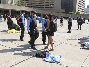 City of Toronto security officers moved in to the tent city encampment at Nathan Phillips Square and told the group known as Afro-Indigenous Rising (AIR) that their encampment was coming down and being removed, July 10, 2020.