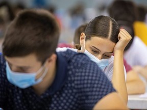 Students take a university exam on June 30, 2020.