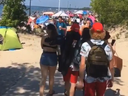 Screenshot of a video taken by @izabellagorski, shown on 6ixBuzzTV's Instagram account, of lots of people gathering at Wasaga Beach over the Canada Day holiday, despite Ontario still being in a state of emergency.