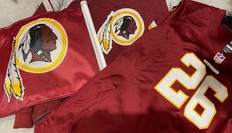 Despite mounting pressure, Redskins owner Dan Synder (left) has refused to change the team’s logo.