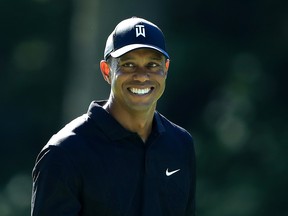 Tiger Woods smiles during a practice round for this week's Memorial Tournament at Muirfield Village Golf Club in Dublin, Ohio.