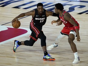 Bam Adebayo of the Miami Heat is defended by Raptors' OG Anunoby during Monday's game.