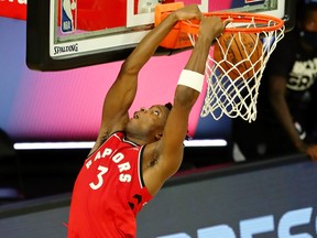 OG Anunoby of the Toronto Raptors makes a reverse dunk against the Brooklyn Nets during the second half in Game 3 of the first round of the NBA playoffs on Friday.