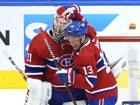Carey Price  and Max Domi of the Montreal Canadiens celebrate their stunning series upset of the Pittsburgh Penguins after winning 2-0 in Game 4 on Friday in Toronto.