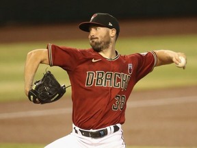 PHOENIX, ARIZONA - AUGUST 16: Starting pitcher Robbie Ray #38 of the Arizona Diamondbacks throws a pitch during the first inning of the MLB game against the San Diego Padres at Chase Field on August 16, 2020 in Phoenix, Arizona.
