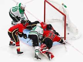 The Dallas Stars’ Radek Faksa (12) scores against the Calgary Flames’ David Rittich in Game 6 of the Western Conference quarterfinal series during the 2020 NHL Stanley Cup playoffs in at Rogers Place in Edmonton on Aug. 20, 2020. Jeff Vinnick/Getty Images