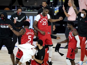 Toronto Raptors players react during the second half of Wednesday's win over the Philadelphia 76ers.