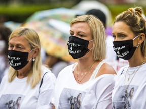 Anna Martin, (middle) is pictured Aug. 16, 2020, during a Queen's Park demonstration which was held to call for tougher laws for impaired, stunt and reckless driving. Martin's sister, Karolina  Ciasullo, along with Ciasullo's three daughters -- Klara, 6, Lilianna, 4, and Mila, 1 -- were killed following a collision in Brampton on June 18.