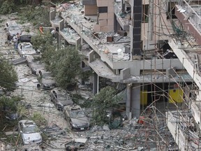 People inspect the damage near the site of Tuesday's blast in Beirut's port area, Lebanon, August 5, 2020.