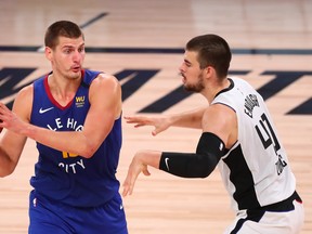 Nuggets centre Nikola Jokic is guarded by Clippers' Ivica Zubac.